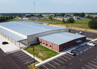 An aerial view of a warehouse facility (showcasing the parking area as well).