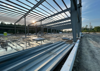 Steel framework under construction at sunset