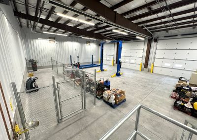 Empty warehouse with visible frames overhead