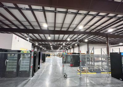 A new industrial warehouse with high ceilings and metal beams.