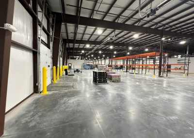 An industrial warehouse that is under construction.
